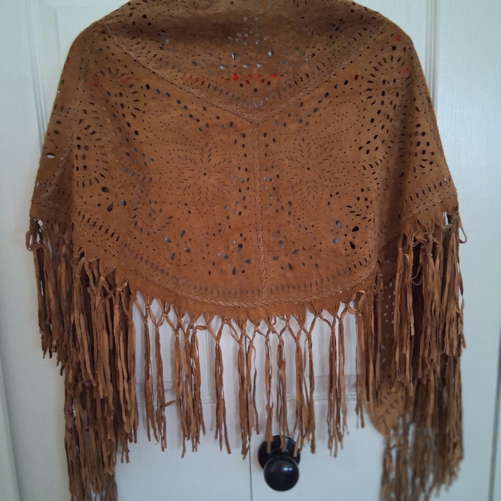 Brown hippie fringe faux suede poncho.